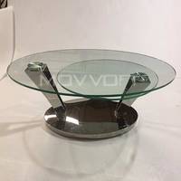 Table basse pivotante ovale en acier inoxydable avec plateau en verre et base argentée avec fonction extensible pour meubles de maison
