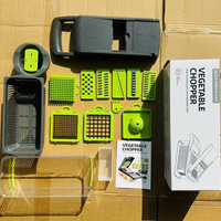Vente en gros de 14 pièces gadgets de cuisine en acier inoxydable ensemble d'accessoires hachoir à fruits et légumes presse-ail oignon râpe à fromage en plastique