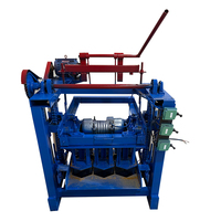 Petite machine manuelle de fabrication de briques en blocs simples pour le ciment et le béton pour les industries domestiques à petite échelle