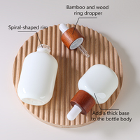 Flacon compte-gouttes ovale en verre Doully pour huiles essentielles et collyres, surface transparente, formats 15 ml et 30 ml, emballage cosmétique