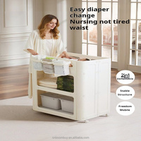Table à langer pliable 2-en-1 convertible en armoire de rangement pour enfants avec roulettes, station de soins mobile pour bébés