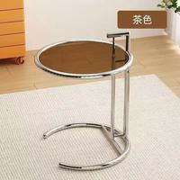Table basse simple et moderne avec plateau en verre réglable et support en métal