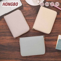 Hongbo meilleure vente noël/bureau personnalisé 24 couleurs A7 galet cuir Zippy Budget portefeuille avec bracelets/bracelet disponible