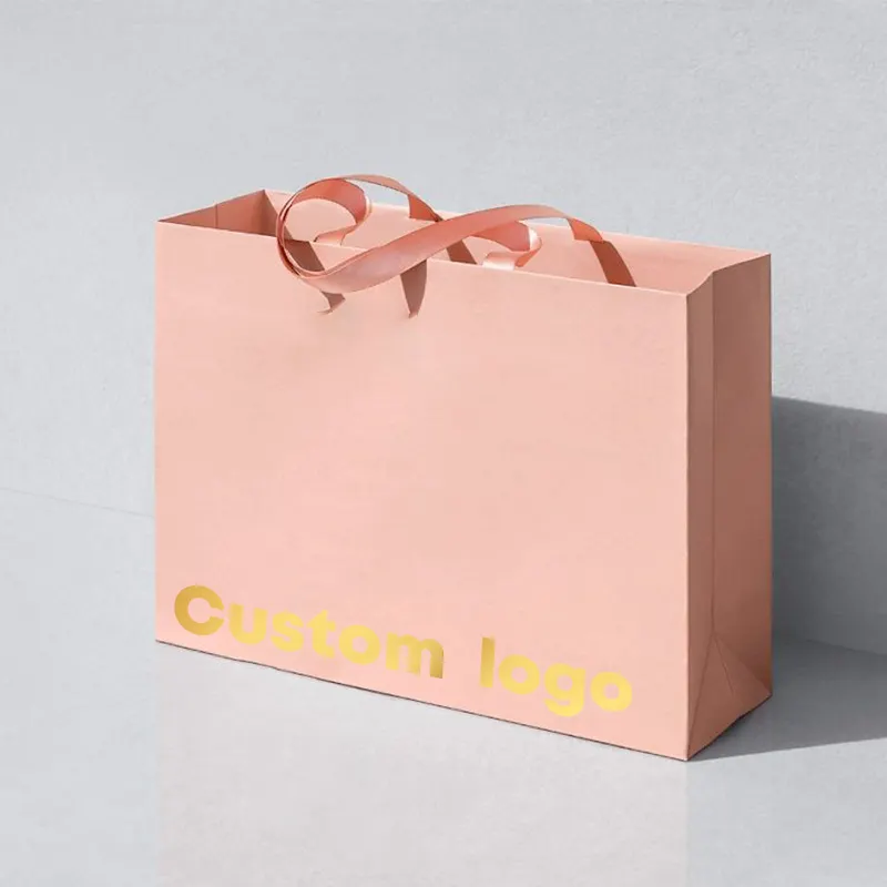 Sacchetto di carta regalo rosa di marca per imballaggio in cartone Boutique di stoffa personalizzata con il tuo Logo
