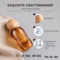 Flacon de parfum vide de luxe personnalisé en verre ambré incurvé 30ml 50ml 100ml avec boîte haut de gamme et bouchon sphérique en bois