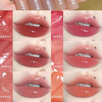 Daimanpu Gelée de thé rose longue durée Glaçure à lèvres liquide Finition miroir brillante Maquillage des lèvres à base de produits chimiques avec logo personnalisé