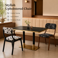 Ensemble table et chaises de restaurant en pierre noire avec chaises en tissu imprimé floral, en vente pour café, traiteur et maison d'hôtes