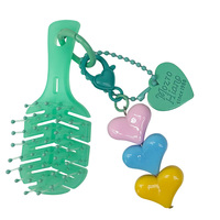 Nouveautés : Brosse à cheveux démêlante compacte en nylon pour voyage et massage, format mini porte-clés, fournisseur fabricant