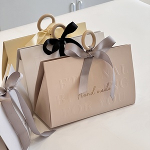Luxury Shopping Paper <b>Bag</b> With Ribbon Handle Logo <b>Hot</b> Foiled Stamping Black Matt Paper <b>Bag</b> With Wood Ring and Ribbon Handle - Product Image 2