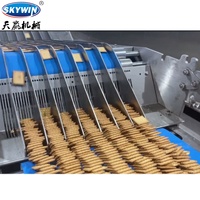 Machine à empiler les biscuits automatique multifonctionnelle pour différentes machines à fabriquer des biscuits et des en-cas