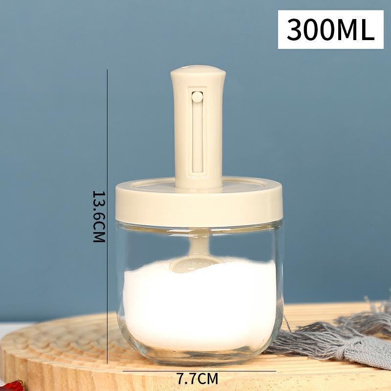 transparent bottle with beige cap and spoon