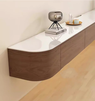Meuble TV suspendu moderne et simple pour salon, idéal pour petits appartements, avec table basse intégrée en panneau de roche.