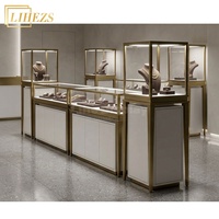 Comptoir de présentation de bijoux en verre trempé blanc or haut de gamme avec rangement intégré