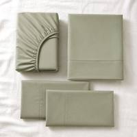 Parure de lit 4 pièces moderne en polyester tissé vert uni avec taies d'oreiller pour la maison, les mariages et l'hôtellerie