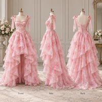 Robe de soirée formelle personnalisée pour femme en organza à imprimé floral, avec corset, bretelles à nœuds, volants superposés et jupe asymétrique