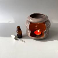 Brûleur à huile en céramique rond personnalisé brûleur de cire essentielle brûleur de cire chauffe-plat pour parfum d'intérieur