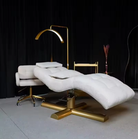 Table de massage multifonctionnelle moderne Union Win pour salon de beauté, en cuir PU, base en métal doré, pliable, lit incurvé pour extensions de cils