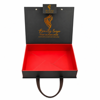 Boîte cadeau de luxe noire et rouge pour perruques avec poignées en cuir, boîte rigide en papier personnalisée pour les marques d'extensions capillaires