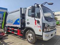 Camion poubelle compactable avec benne capable de suspendre deux bacs à déchets en plastique de 240 L