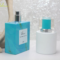 Botella de Perfume de Vidrio de 50 ml con Cabezal Pulverizador, Decoración Personalizada, Venta Caliente, Precio Bajo, Transferencia de Calor al Vacío, Efecto Marmoleado Azul Cielo