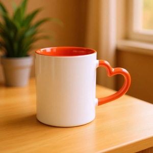 แก้วเซรามิคทรงหัวใจสีขาวส้ม สำหรับชา กาแฟ ของขวัญ ผลิตที่เจ้อเจียง - Product Image 1