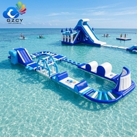 Parc aquatique flottant modulaire gonflable avec toboggan, parcours de jeux aquatiques durable pour les entreprises de parcs aquatiques