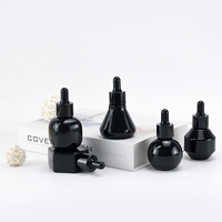 Flacon compte-gouttes en verre opale noir brillant de 30 ml, emballage cosmétique premium pour sérum, idéal pour les marques de produits de beauté et de soins de la peau.