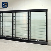 Vitrine en verre au détail à cadre en métal noir Vitrine en verre trempé Full Vision Verrouillable Design de vitrine de magasin