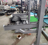Rack de musculation multifonctionnel à charge par plaques pour demi-squat, idéal pour les clubs de fitness et l'entraînement de force