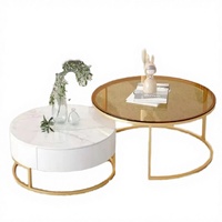 Table basse moderne convertible pour salon en verre blanc avec structure en métal doré et rangement