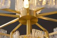 Lustre suspendu linéaire moderne de luxe en laiton et verre pour plafond bas, idéal pour table à manger