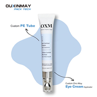 Emballage personnalisé pour crème pour les yeux en alliage métallique avec applicateur de massage en alliage de zinc, tube souple en plastique vide