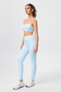 Sports bra and yoga pants set featuring a crisscross back; the pants lift the glutes and flatter the figure. - Product Image 3