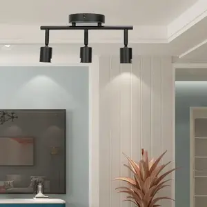 Spot à trois lampes noir, compatible avec les ampoules E27, idéal pour créer des ambiances personnalisées dans les maisons et les bureaux. - Product Image 3