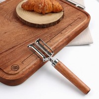 Handmatige multifunctionele houten handgreep van roestvrij staal Twee-in-één multifunctionele draadafschiller Fruit- en groenteschilmesje