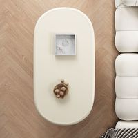 Grande table basse polyvalente de style crémeux à texture haut de gamme pour tout salon Rangement de forme ovale pour appartement de petite taille