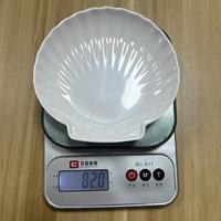 Grande taille et petite taille comme un ensemble de plaques de mélamine de couleur blanche en forme de coquille