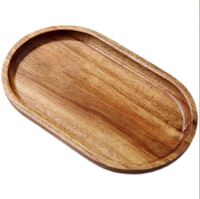 Petite assiette de service ovale en bois d'acacia