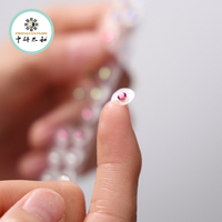 Graines d'oreille adhésives transparentes de couleur chakra pour l'auriculothérapie avec cristal d'acupuncture