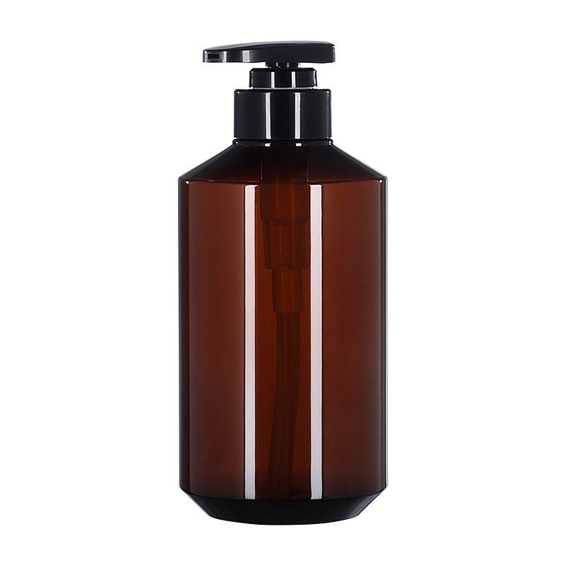 ขวดสีเหลืองอำพันพร้อมหัวปั๊มสีดำ