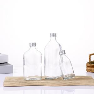 Bouteille vide transparente haut de gamme, plate et ronde, 50 ml/100 ml/250 ml, adaptée au brandy, au gin, au rhum, à la vodka, à la <span class=keywords><strong>tequila</strong></span>, avec bouchon en aluminium - Product Image 6