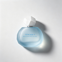 Flacon de parfum en verre givré bleu clair à facettes avec bouchon blanc multi-panneaux, conteneur vide pour vaporisateur de parfum