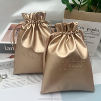 Pochette d'emballage cosmétique en cuir PU doré haut de gamme avec logo personnalisé en relief, sac cadeau shopping en cuir doré brillant