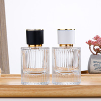 Flacon de parfum en verre transparent OEM 30ml 50ml, cylindre vide, luxe, noir mat, couvercle magnétique, boîte cadeau, vaporisateur à pompe, emballage