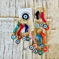 Porte-clés en gros motif œil porte-bonheur, cordon tressé, doré, pendentif de protection, style dessin animé tendance, décoration de sac, fabricant