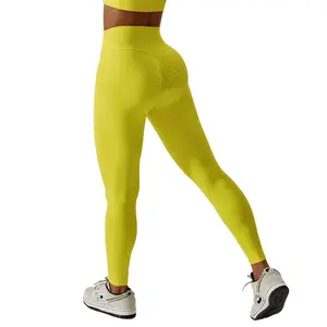 กางเกงเลกกิ้งเอวสูงของผู้หญิงกางเกงสีเหลืองสำหรับเล่นกีฬาฟิตเนสเล่นยิมใหม่ไร้รอยต่อ