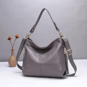 A soft cowhide daily <b>bag</b> paired with a vintage and simple large-capacity crossbody <b>bag</b> held <b>over</b> the <b>shoulder</b> - Product Image 3
