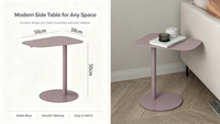 Table basse Eaho au design moderne et élégant en fer, avec plateau asymétrique réglable