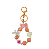 Promotion : Bracelet mignon à nœud perlé, pendentif cœur et fleur, accessoire de coque de téléphone, dragonne porte-clés, breloque colorée pour sac