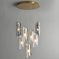 Lustre d'art moderne avec texture aléatoire de verre, acier inoxydable et hauteur réglable pour escalier, grenier, salon